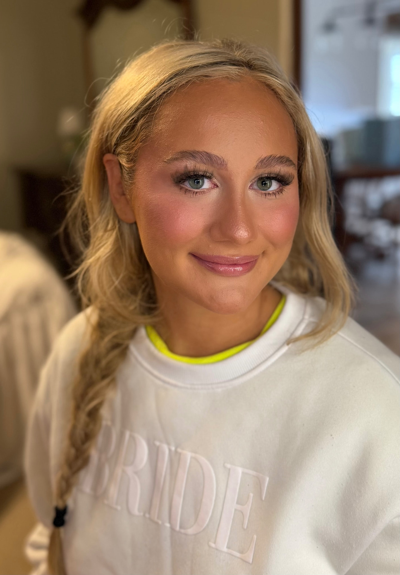 Bridal soft glam with rosy blush, glossy pink lip and braided hair