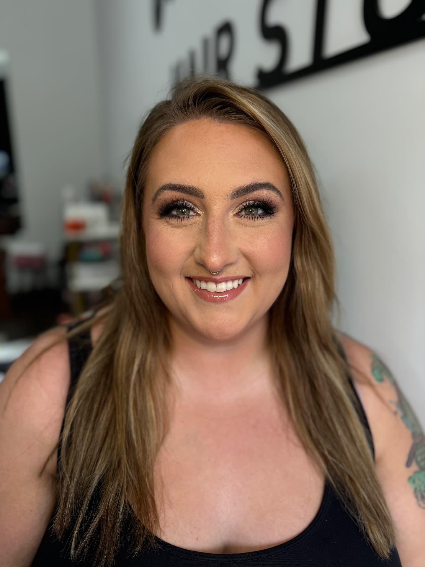 Smoky mauve eye with warm blush and glossy berry lip