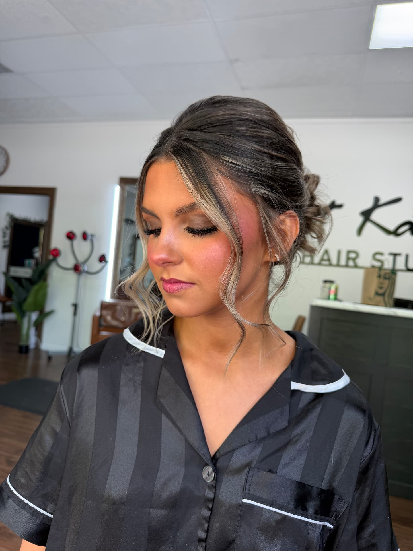 Updo with soft blended eye makeup and glowing skin