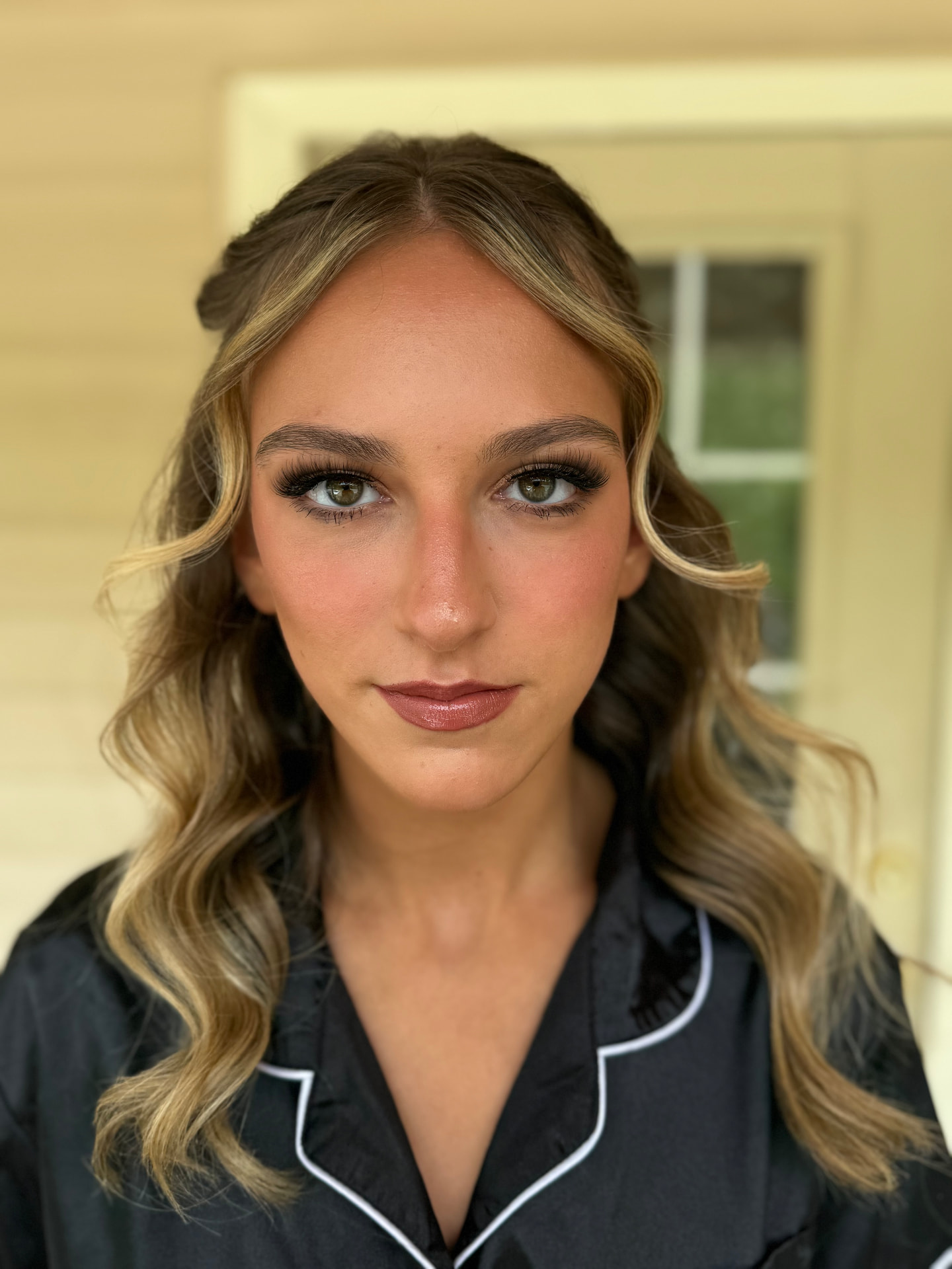 Sculpted glam with warm blush, bold lashes and mauve lip