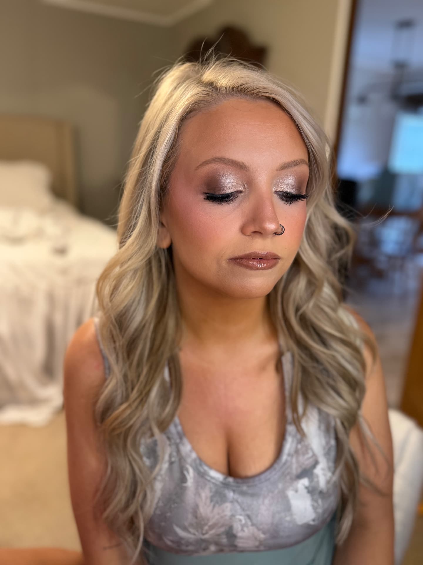 Silver-mauve shimmer eyeshadow with soft contour and glossy lip