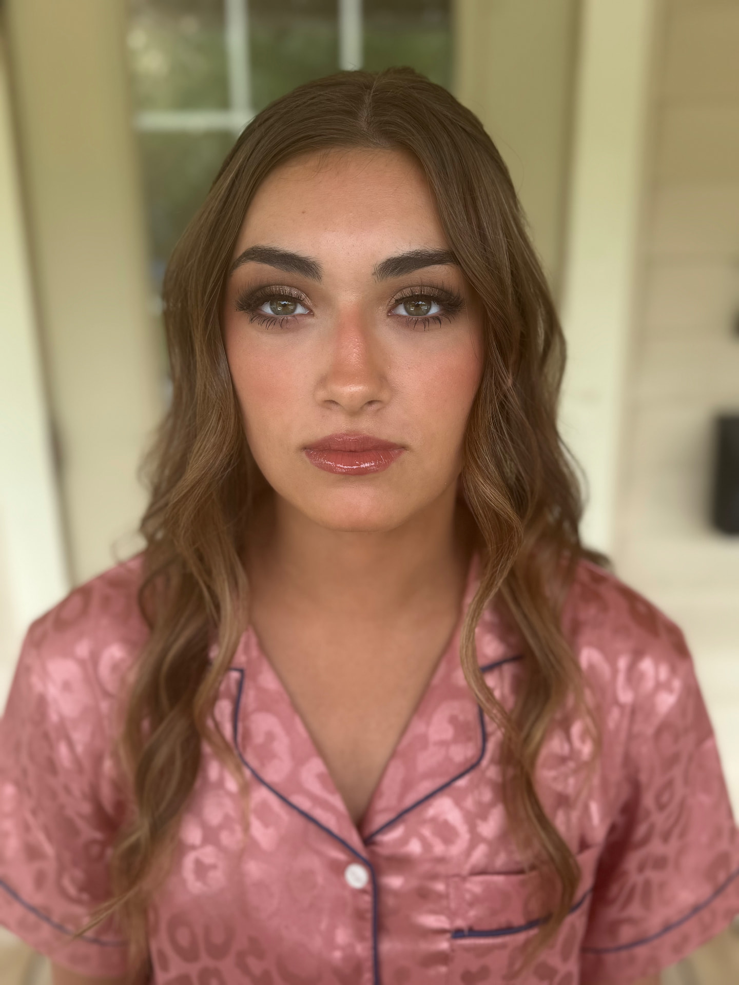 Bronzed soft glam with defined brows and glossy nude lip