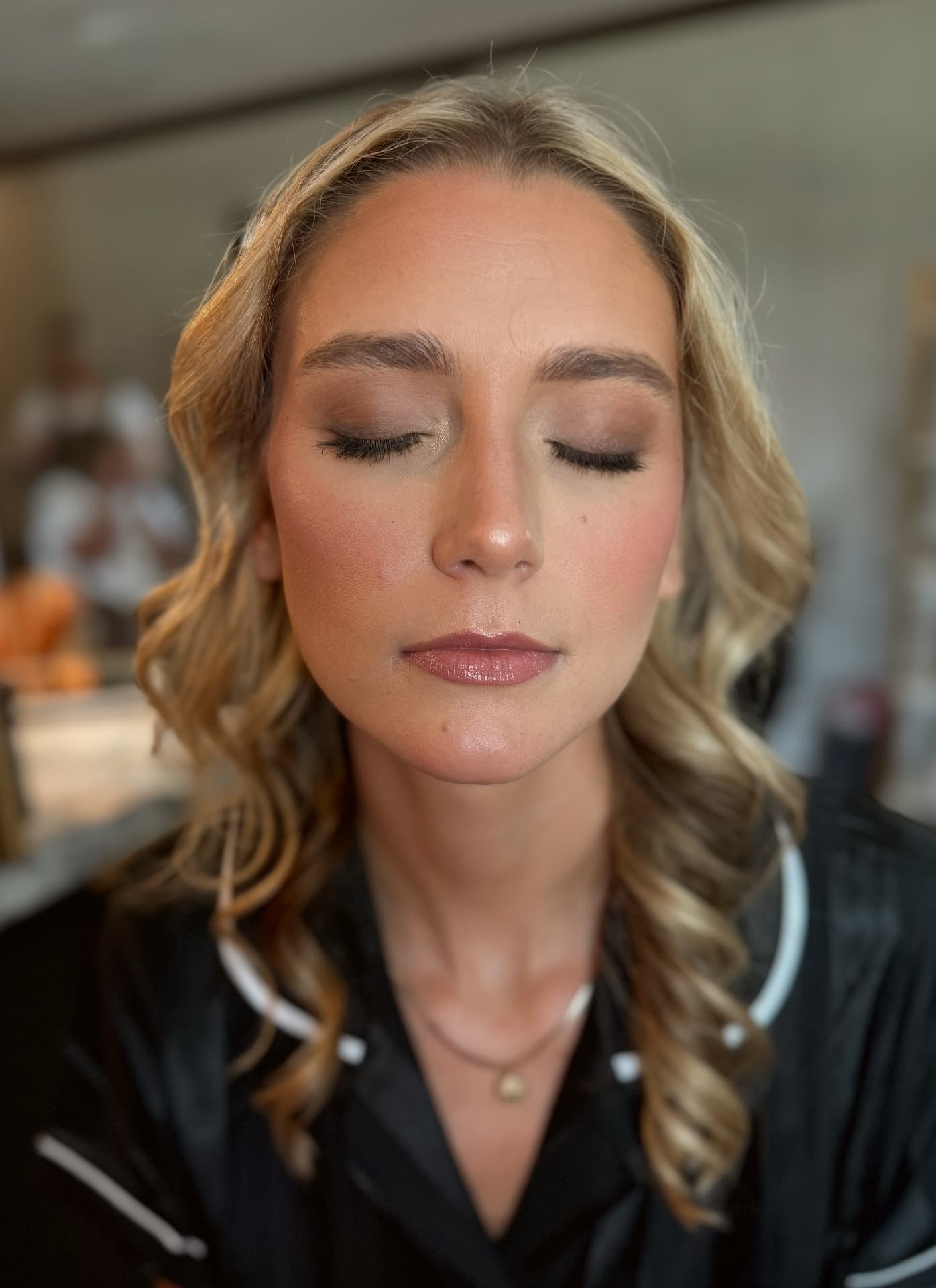 Neutral taupe smoked eye with dewy skin and satin nude lip