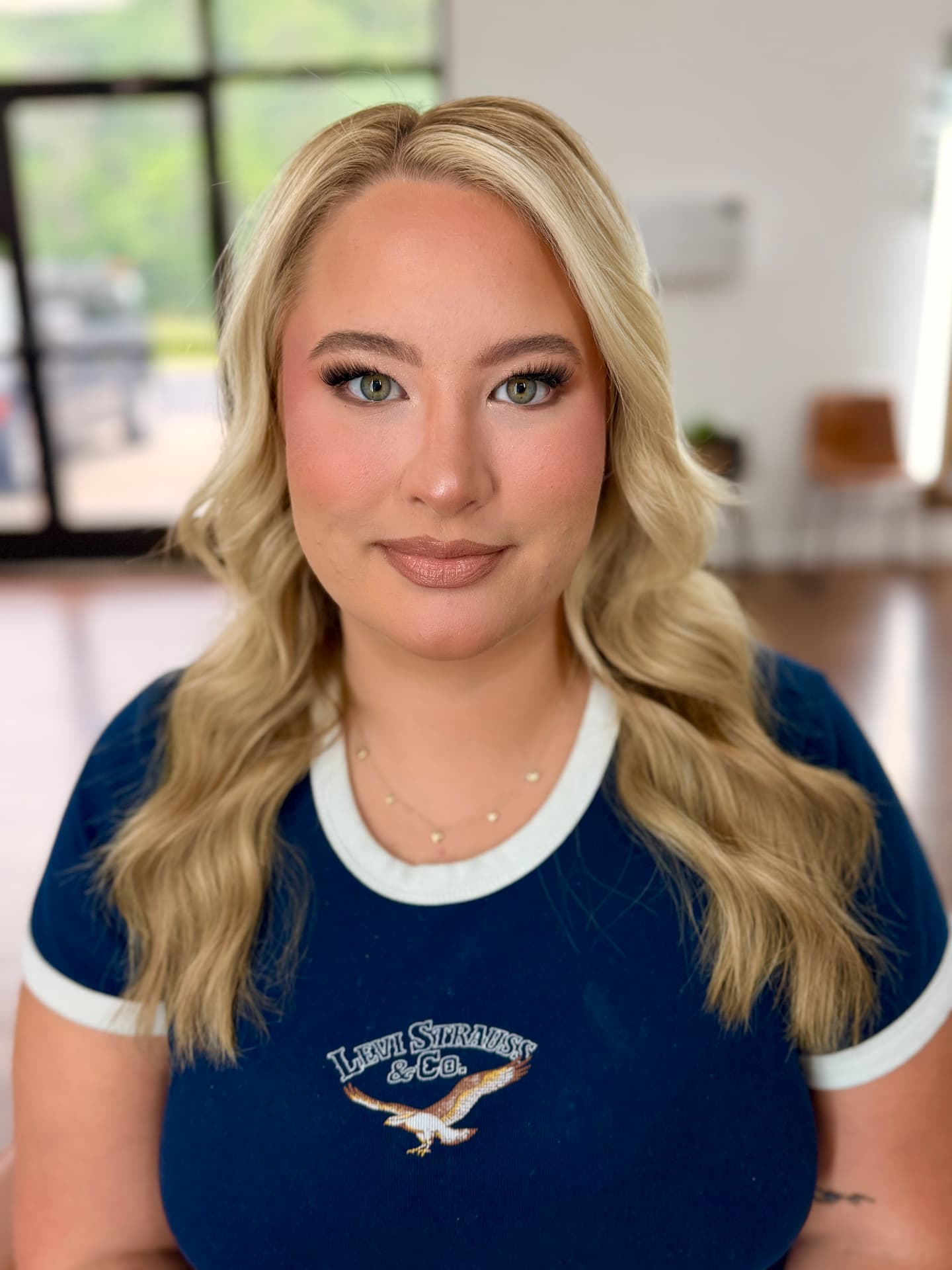 Soft glam with peach blush, glowing skin and nude lip
