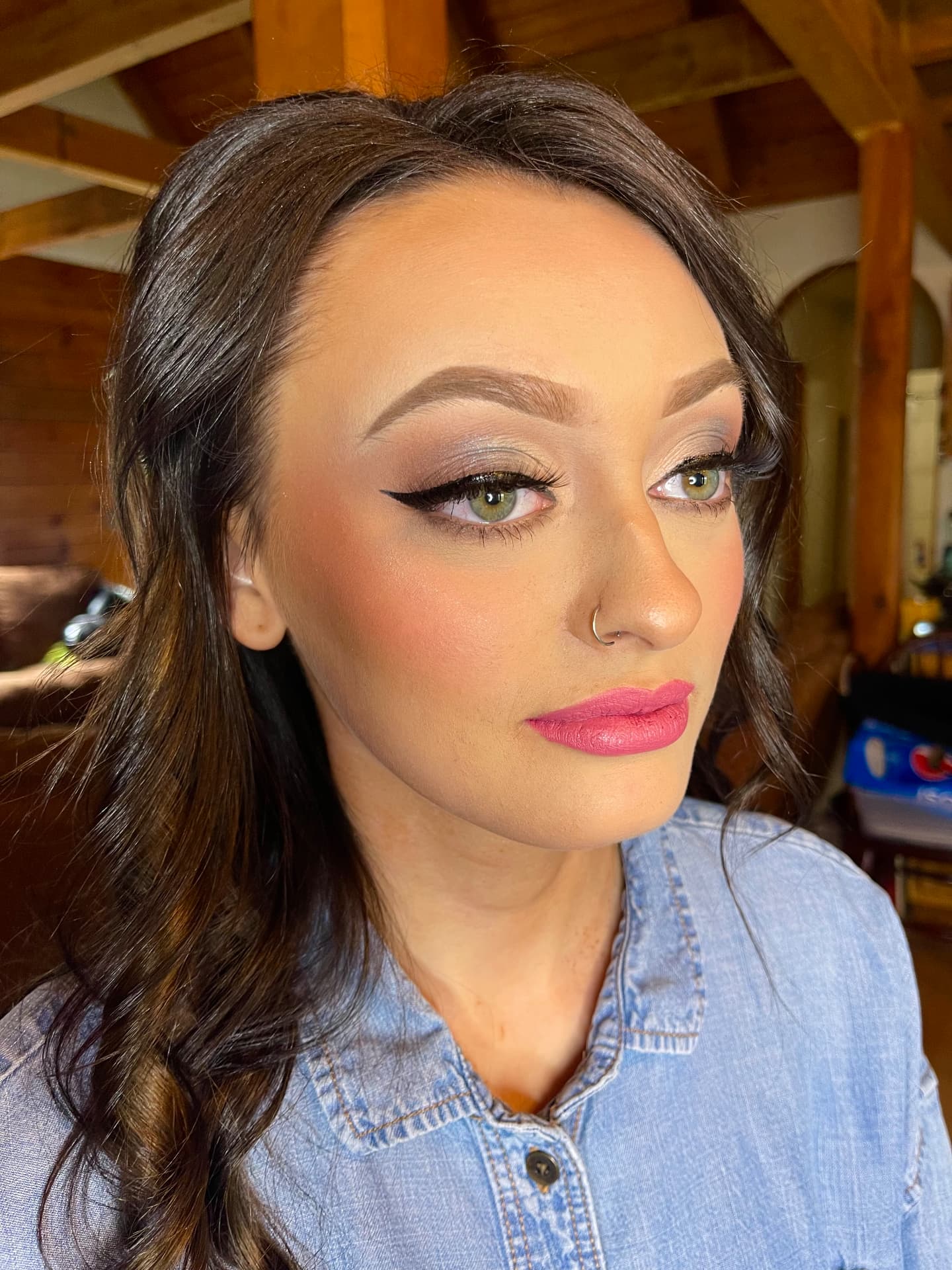 Classic winged liner with soft taupe eye and rose matte lip