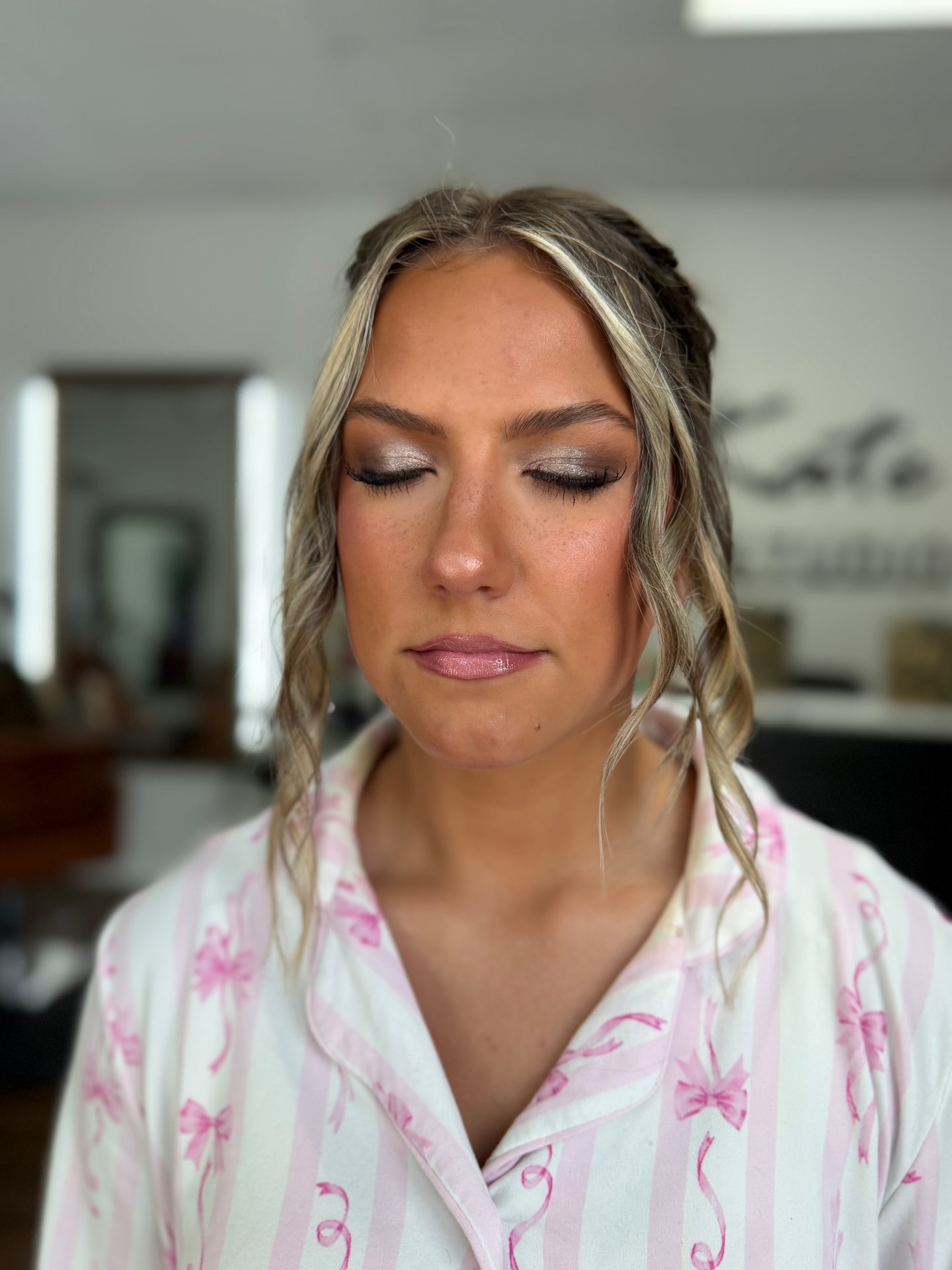 Silver shimmer eye makeup with dewy skin and lash extensions