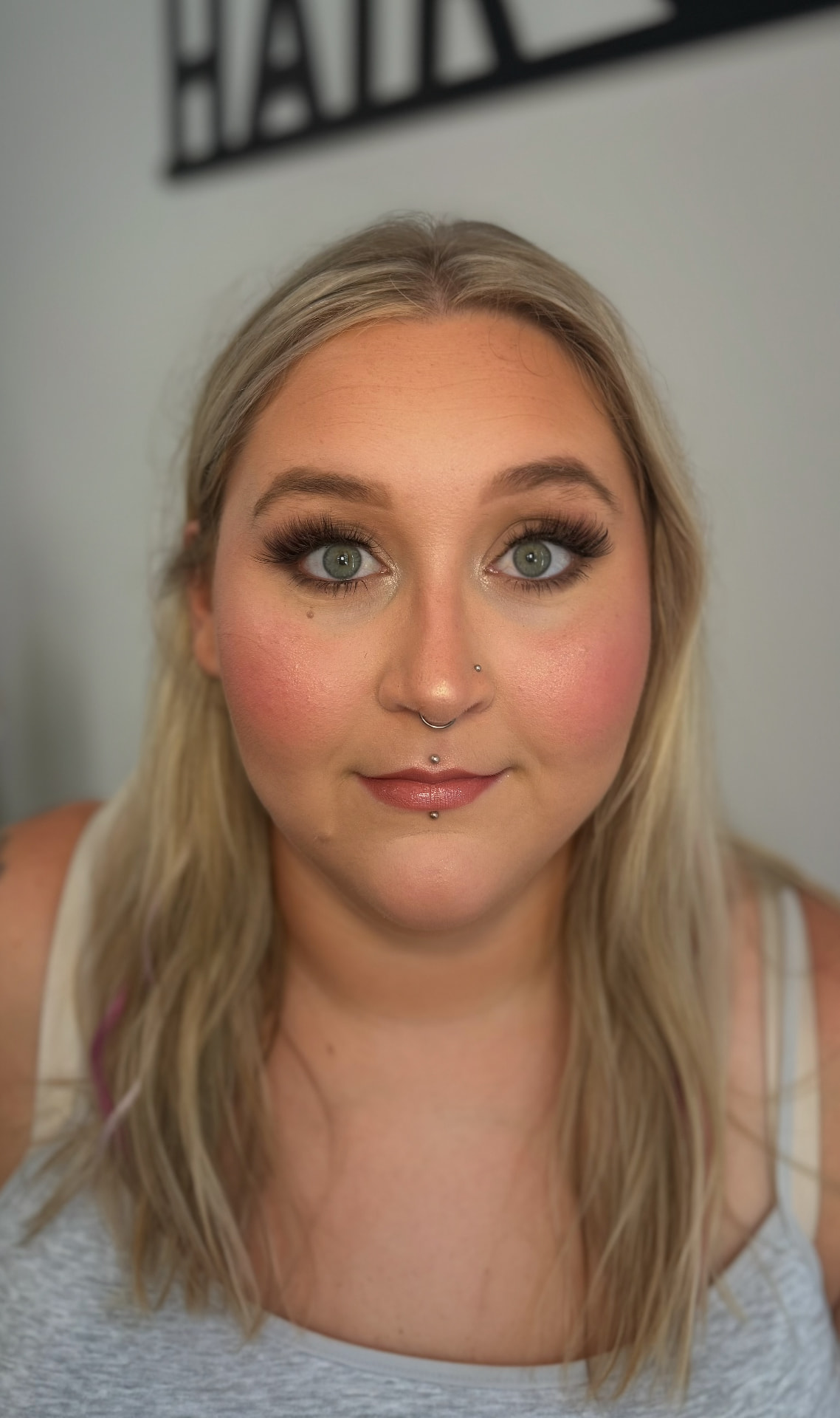 Soft neutral eye with rosy blush, bold lashes and nude gloss