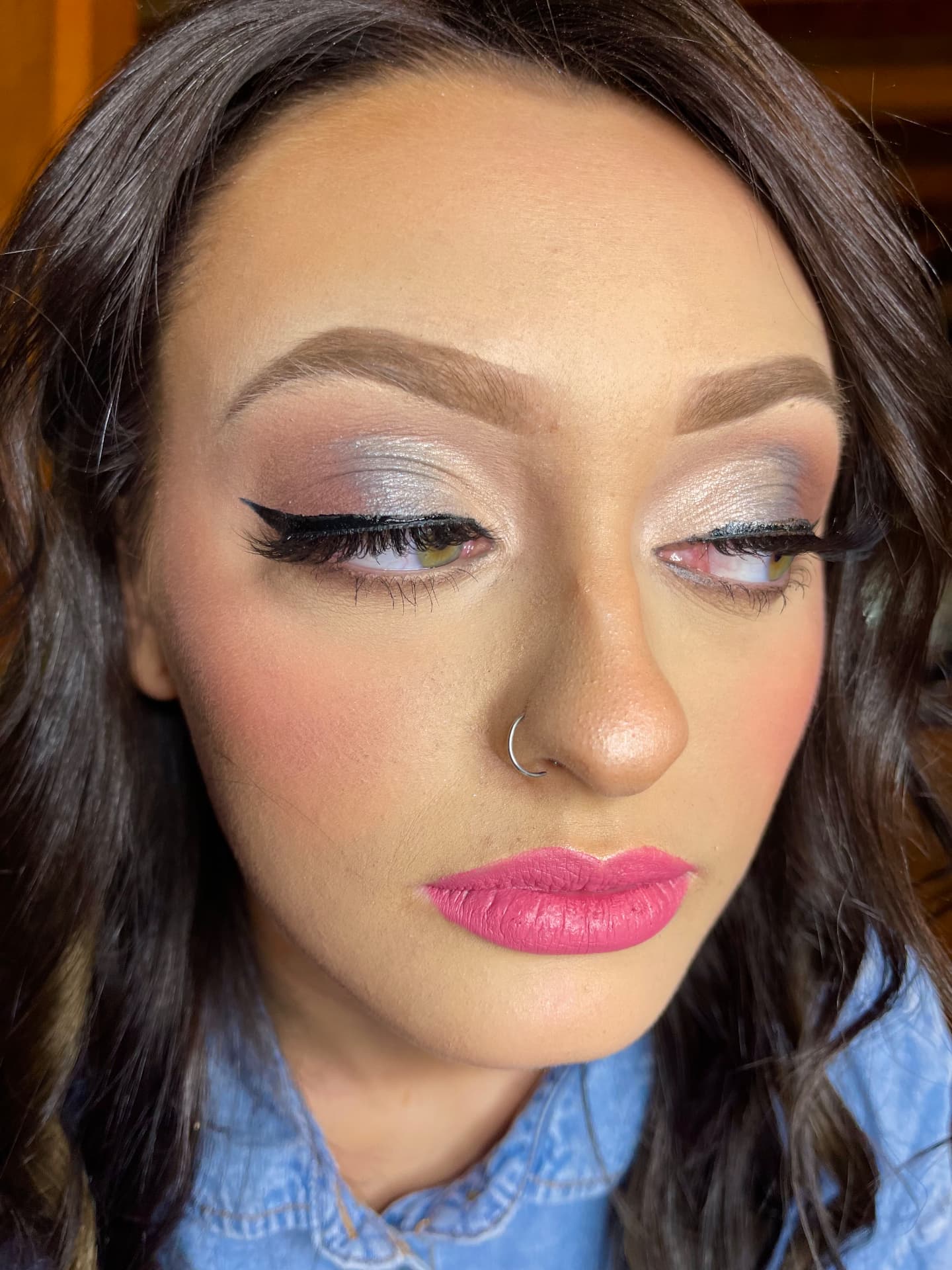 Silver shimmer cut crease with sharp liner and pink matte lip